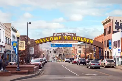 a welcome to golden sign over a city street at Hampton Inn Denver-West/Golden in Golden