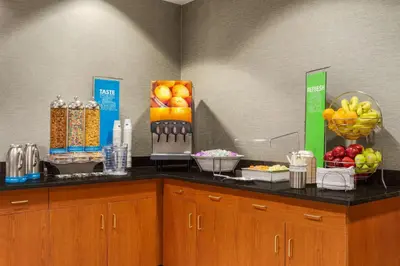 a counter with fruits and other food items on it at Hampton Inn & Suites Denver-Cherry Creek in Denver