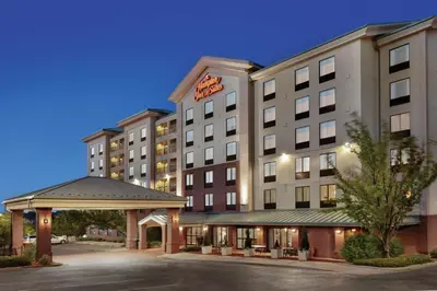 a hotel building with a gazebo in front of it at Hampton Inn & Suites Denver-Cherry Creek in Denver