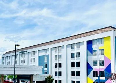 a building with a colorful mural on the side of it at Spark by Hilton Denver Tech Center Greenwood Village in Greenwood Village