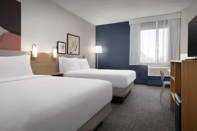 a hotel room with two beds and a window at Spark by Hilton Denver Tech Center Greenwood Village in Greenwood Village