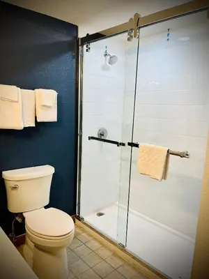 a bathroom with a shower and a toilet at Spark by Hilton Denver Tech Center Greenwood Village in Greenwood Village