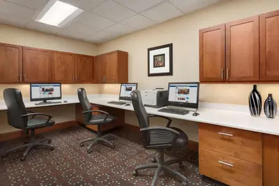 an office cubicle with two desks with computers on them at Hampton Inn Denver West Federal Center in Lakewood