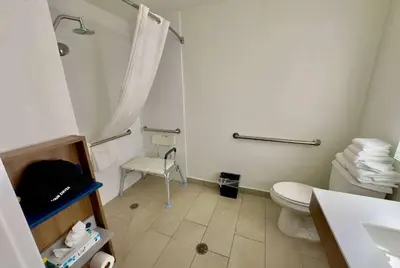 a bathroom with a white toilet and a sink at Microtel Inn & Suites by Wyndham Denver Airport in Denver