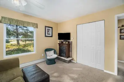 a living room with a door and a tv at Wild Flower - EV #3197 in Estes Park