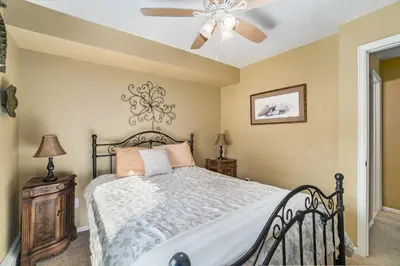 a bedroom with a bed and a ceiling fan at Wild Flower - EV #3197 in Estes Park