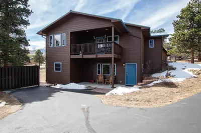 a house with a deck and a balcony at Wild Flower - EV #3197 in Estes Park