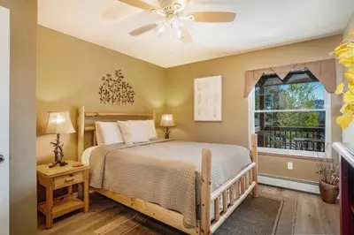 a bedroom with a bed and a window at Aspen Grove Getaway - EV #3196 in Estes Park