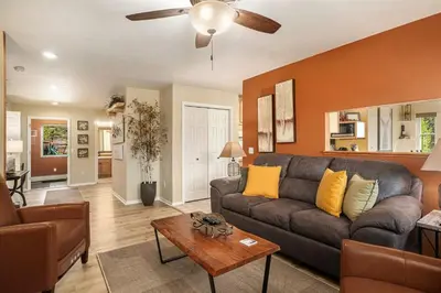 a living room with a couch and a table at Aspen Grove Getaway - EV #3196 in Estes Park