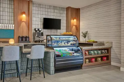 a restaurant with a refrigerators at Delta Hotels by Marriott Denver Thornton in Westminster