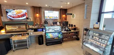 a grocery store with a counter and a refrigerator at Delta Hotels by Marriott Denver Thornton in Westminster