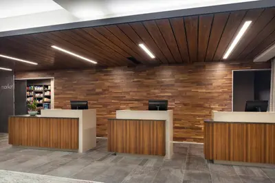 an office lobby with a brick wall at Courtyard Denver Airport at Gateway Park in Denver