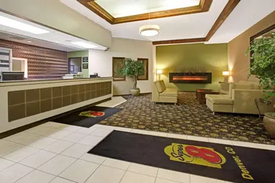 a lobby of a hospital with chairs and a waiting room at Super 8 by Wyndham Wheat Ridge/Denver West in Wheat Ridge