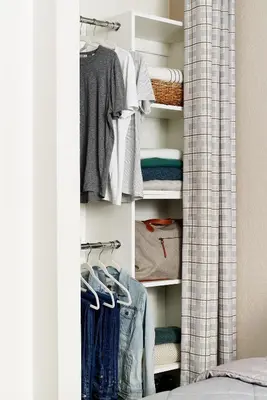 a closet filled with lots of clothes at InTown Suites Extended Stay Select Denver - Aurora South in Aurora