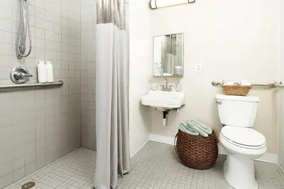 a bathroom with a toilet and a sink at InTown Suites Extended Stay Select Denver - Aurora South in Aurora