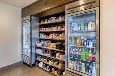 a refrigerator filled with lots of drinks at Comfort Suites Near Denver Downtown in Denver