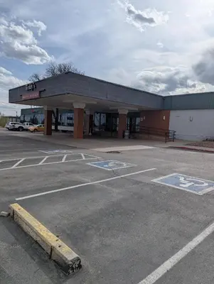 an empty parking lot in front of a gas station at Plaza Hotel Denver Central in Denver