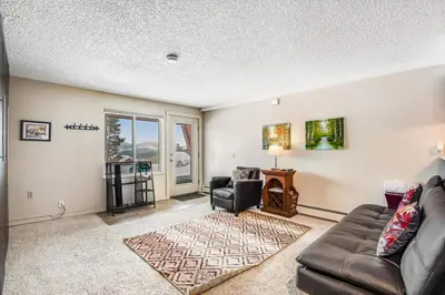 a living room with a couch and a chair at Silver Queen 7300 in Silverthorne