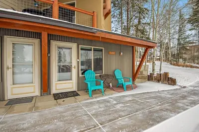 a house with two chairs and a table on a porch at Silver Queen 7300 in Silverthorne