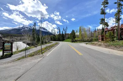 an empty road with a mountain in the background at Silver Queen 7300 in Silverthorne