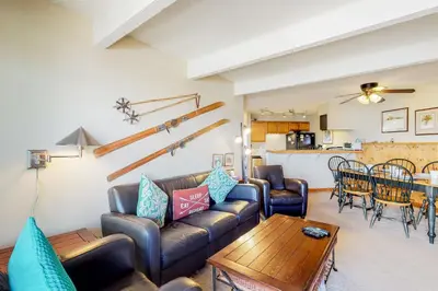 a living room with a couch and a table at 2 Bed 1 Bath Apartment in Wildernest, CO in Silverthorne