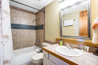 a bathroom with a sink and a tub and a toilet at 2 Bed 1 Bath Apartment in Wildernest, CO in Silverthorne