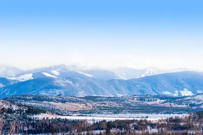 a view of a mountain range with snow covered mountains at 2 Bed 1 Bath Apartment in Wildernest, CO in Silverthorne