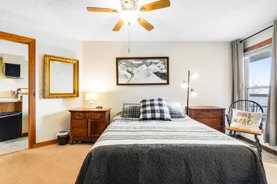 a bedroom with a bed and a ceiling fan at 2 Bed 1 Bath Apartment in Wildernest, CO in Silverthorne