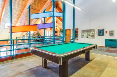 a pool table in a room with a ceiling at 2 Bed 2 Bath Apartment in Summit County in Silverthorne