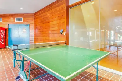 a ping pong table sitting in a room with at 2 Bed 2 Bath Apartment in Summit County in Silverthorne