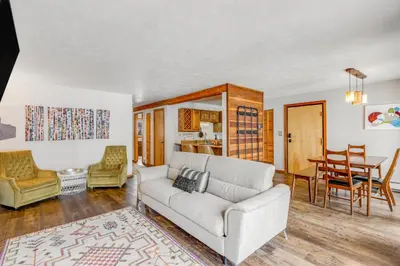 a living room with a couch and a table at 2 Bed 2 Bath Apartment in Summit County in Silverthorne