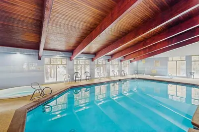 a large indoor swimming pool in a building at Beaver Village in Winter Park