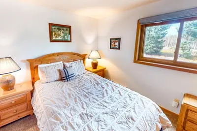 a bedroom with a bed and a window at Timber Ridge 203 in Silverthorne