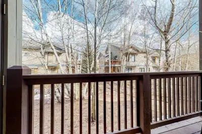 a view of a house from a wooden balcony at Tarn Landing B7 in Frisco