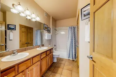 a bathroom with two sinks and a toilet at Tarn Landing B7 in Frisco