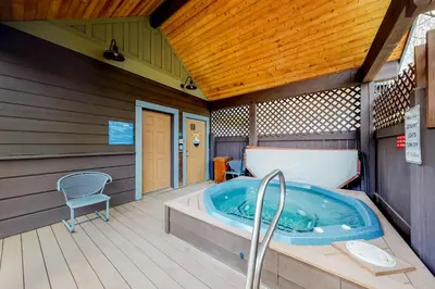 a jacuzzi tub in a house with a chair at Tarn Landing B7 in Frisco
