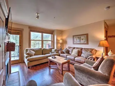 a living room with couches and a coffee table at 3 Bedroom Mountain View Condo In River Run Village Just 75 Yards From The Summit Express Gondola in Keystone