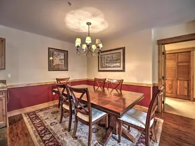 a dining room with a wooden table and chairs at 3 Bedroom Mountain View Condo In River Run Village Just 75 Yards From The Summit Express Gondola in Keystone