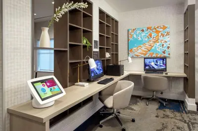 an office with a desk with two computers on it at Tru By Hilton Denver Airport Tower Road in Denver