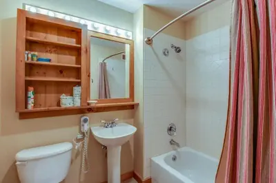 a bathroom with a sink and a toilet and a shower at 1 Bedroom Plus Murphy Mountain Condo In River Run Village With Hot Tub Access And Walking Distance To Ski in Keystone