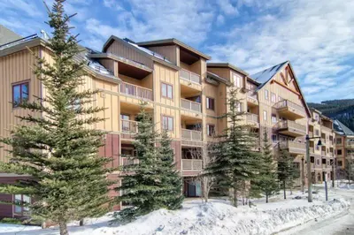 a large apartment building with trees in the snow at 1 Bedroom Colorado Mountain Vacation Rental In River Run Village With Convenient Access To Ski Slopes in Snake River Health Services Incorporated Heliport