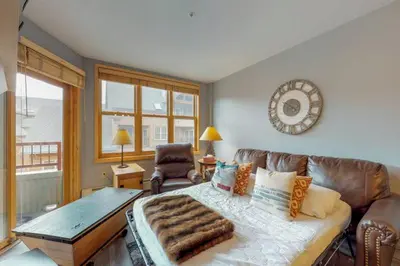 a living room with a couch and a table at 1 Bedroom Mountain Condo In River Run Village With Beautiful Mountain Views And Walking Distance To Ski in Keystone