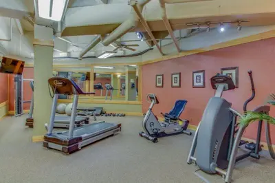 a gym with several exercise equipment in a room at 1 Bedroom Mountain Condo In The Heart Of River Run Village Within Walking Distance To Ski in Keystone