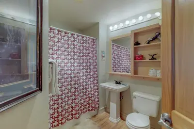 a bathroom with a white toilet and a shower at 1 Bedroom Mountain Condo In The Heart Of River Run Village Within Walking Distance To Ski in Keystone