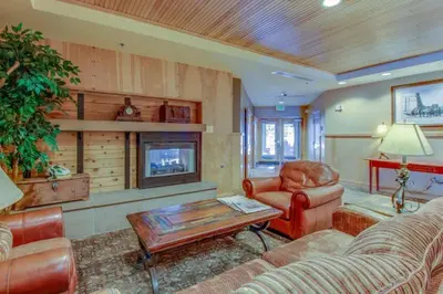 a living room with a couch and a table at 1 Bedroom Mountain Condo In The Heart Of River Run Village Within Walking Distance To Ski in Keystone