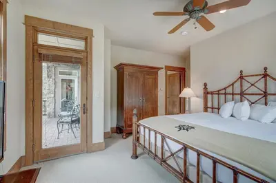 a bedroom with a bed and a ceiling fan at Premier 3 Bedroom Ski In, Ski Out Lone Eagle Condo With The Best Access To Skiing In Keystone in Keystone
