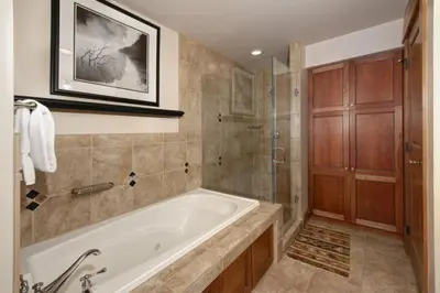 a large bathroom with a tub and a shower at Premier 2 Bedroom Ski In, Ski Out Lone Eagle Condo With The Best Access To Skiing In Keystone in Keystone