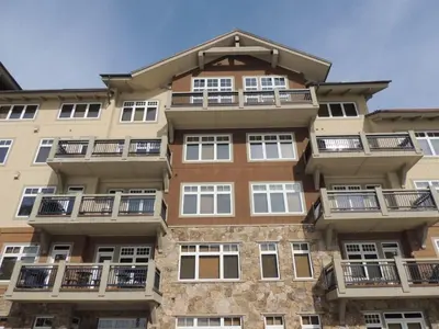 a tall building with balconies on the side of it at Premier 2 Bedroom Ski In, Ski Out Lone Eagle Condo With The Best Access To Skiing In Keystone in Keystone