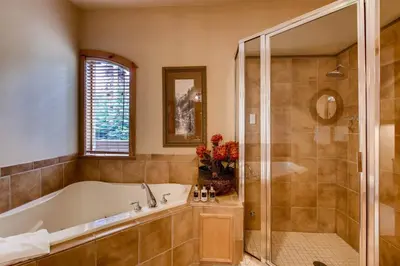a large bathroom with a tub and a shower at Premier 3 Bedroom Timbers Ski In, Ski Out Vacation Rental At The Timbers With The Best Access To Skiing In Keystone in Keystone