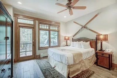 a bedroom with a bed and a ceiling fan at Premier 1 Bedroom Ski In, Ski Out Lone Eagle Condo With The Best Access To Skiing In Keystone in Keystone